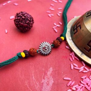 Silver Om rakhi in cotton threads