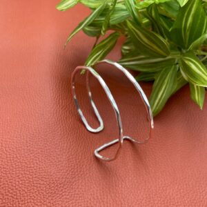 Asymetrical silver bangle