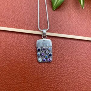 Silver pendant with stones studded