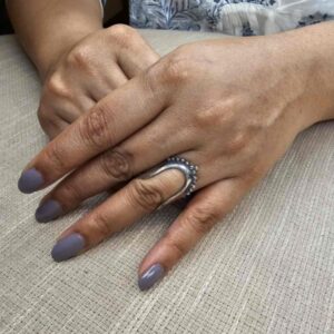 Silver Vanki Ring with tribal motifs set in it.